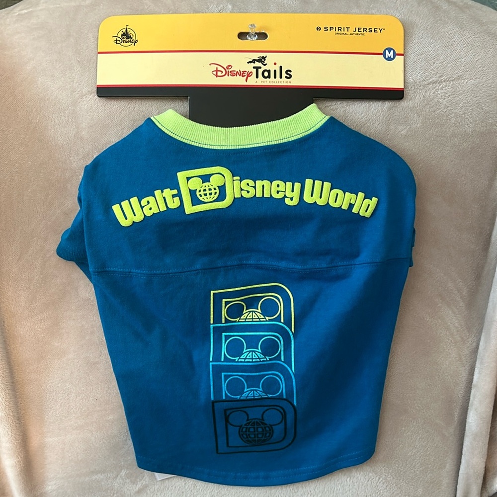 Disney Tails Spirit Jersey.  Blue with yellow/green lettering.  Size M.  NWT